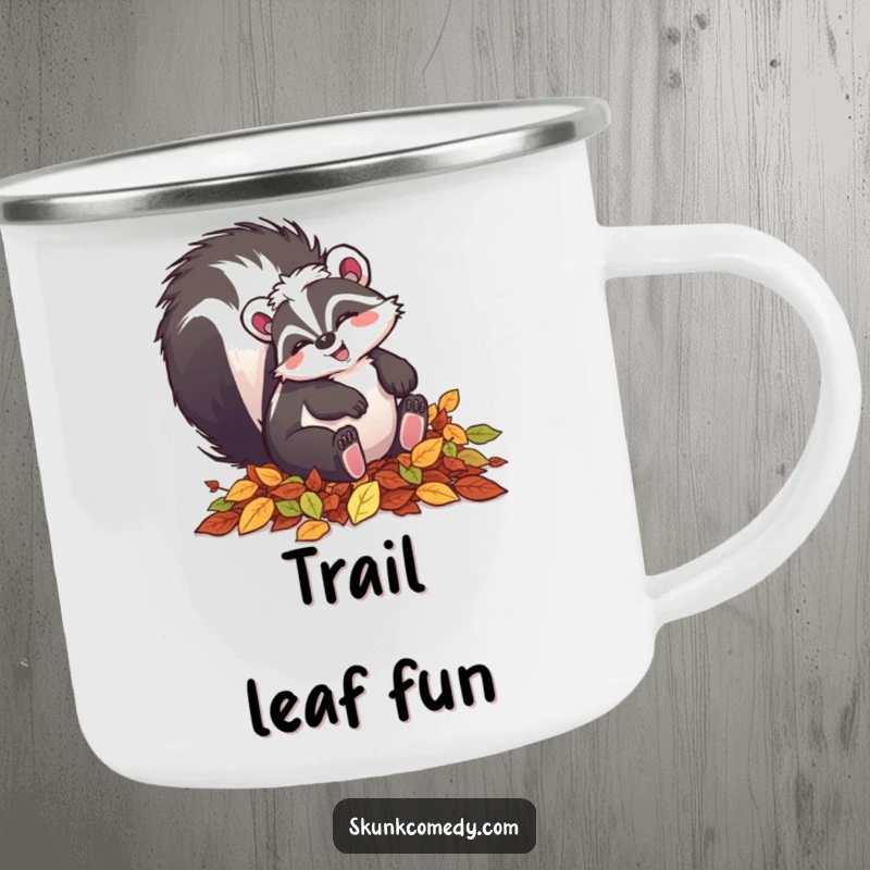 Funny skunk camping mug showing a happy skunk tumbling in autumn leaves, perfect for outdoor enthusiasts.