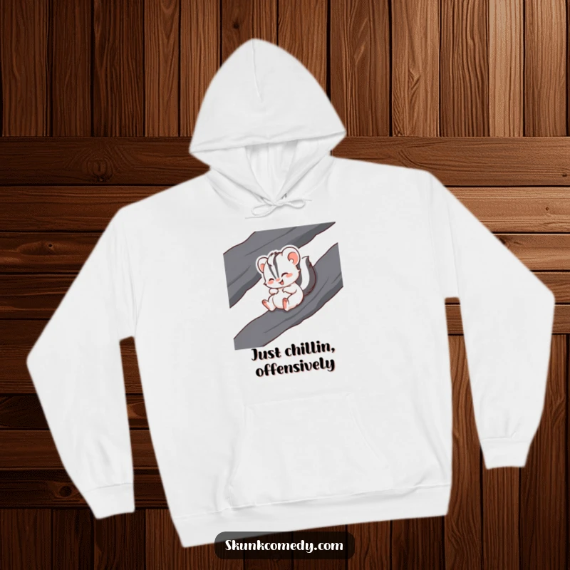 Funny hoodie with a giggling skunk captured mid-slide down a slick, dark rock surface.