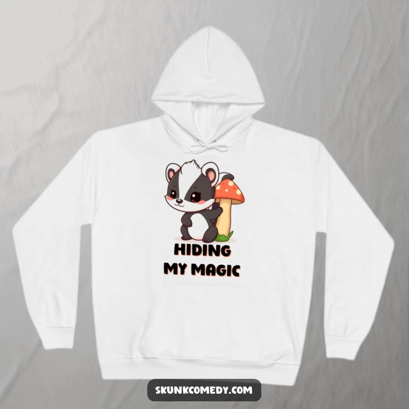 Funny skunk mushroom hoodie, a cute skunk peeks playfully from behind a mushroom, cozy and humorous apparel.