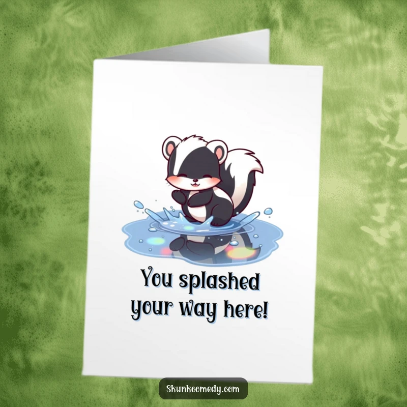 Funny free printable congratulations card featuring a skunk splashing joyfully in a puddle reflecting vibrant rainbow colors.