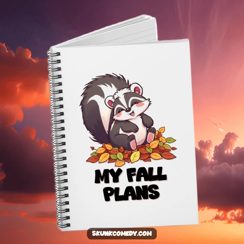 Funny skunk notebook featuring a happy skunk tumbling in autumn leaves, perfect for note-taking.